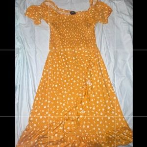 Yellow dress white flowers, wide neck.